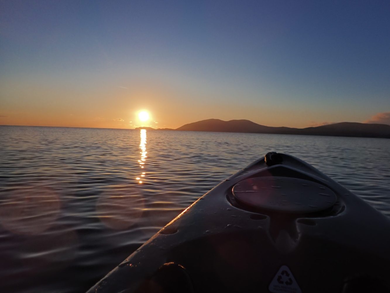 a sunset over a body of water